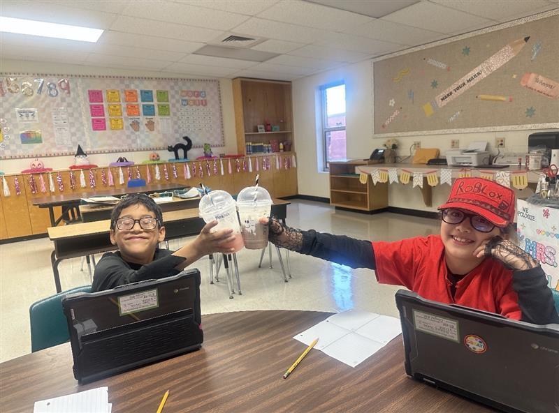 Students cheering with treat.