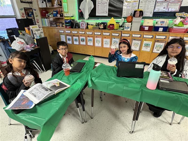 Students posing with treat.