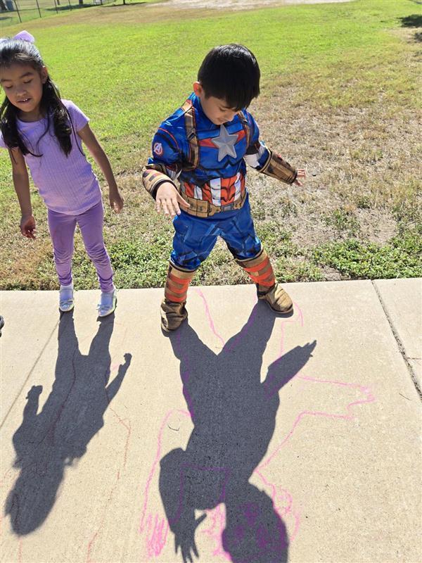 Students participating in tracing shadows activity.
