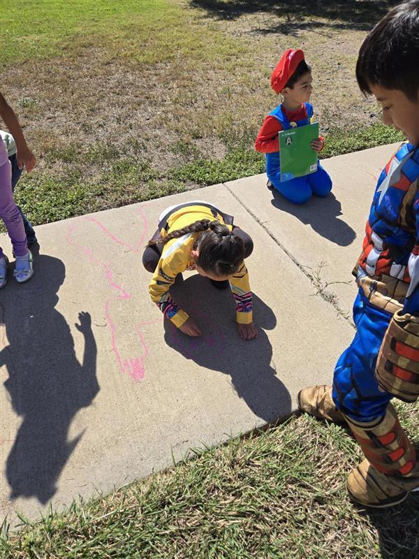 Students participating in tracing shadows activity.