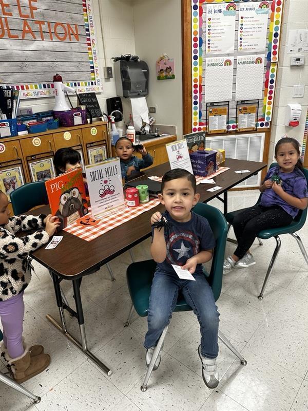 Student posing with worry monster.