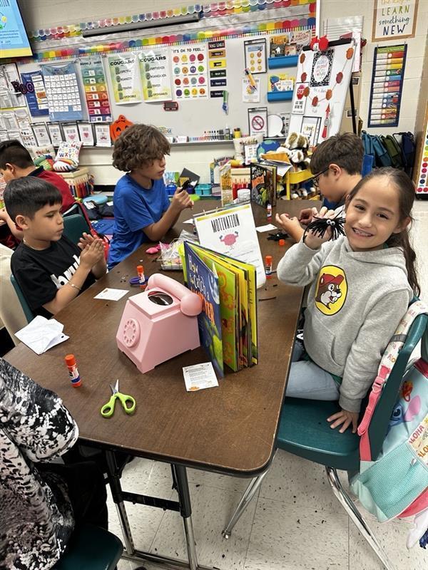 Student posing with worry monster.