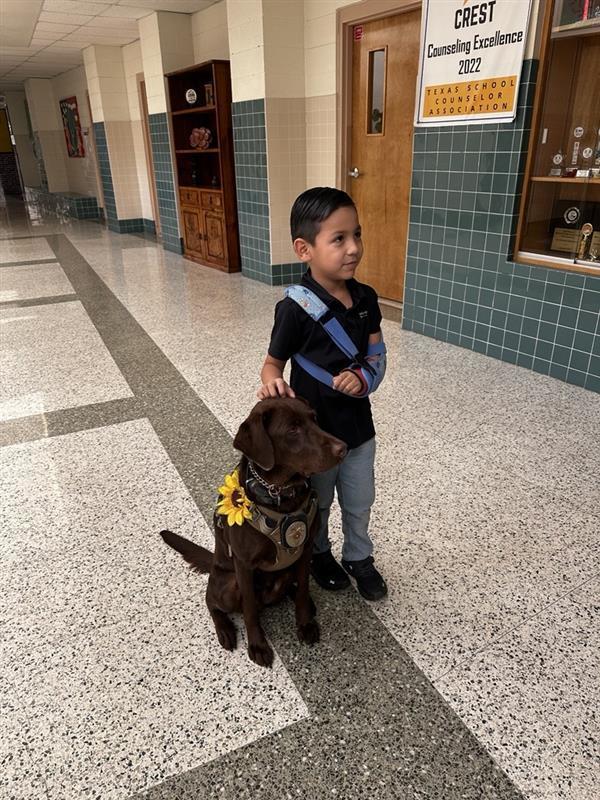 Student posing with K9.