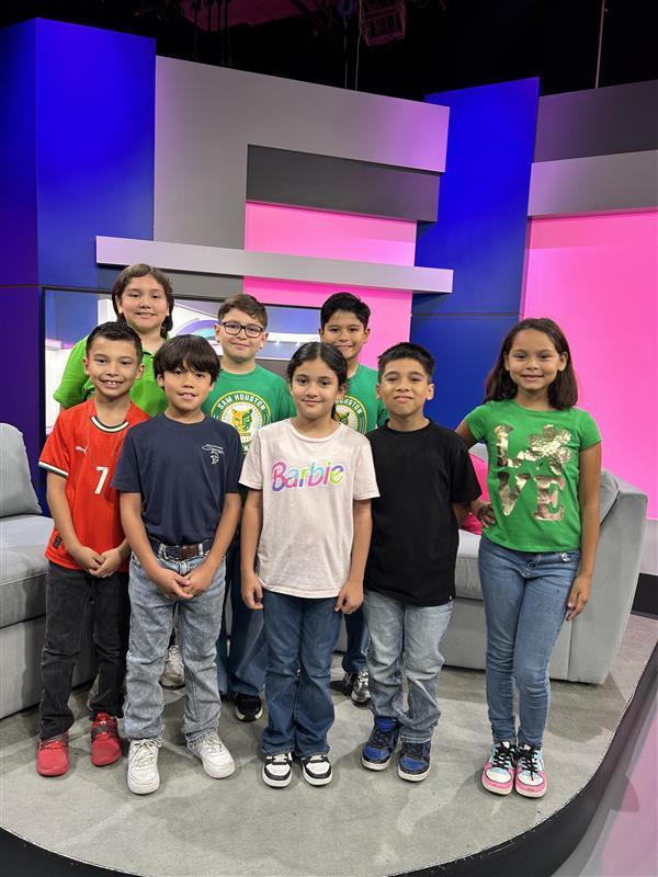 Students posing at KRGV Newsroom.
