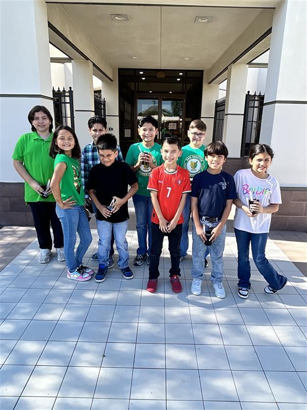 Students posing outside the KRGV Newsroom.