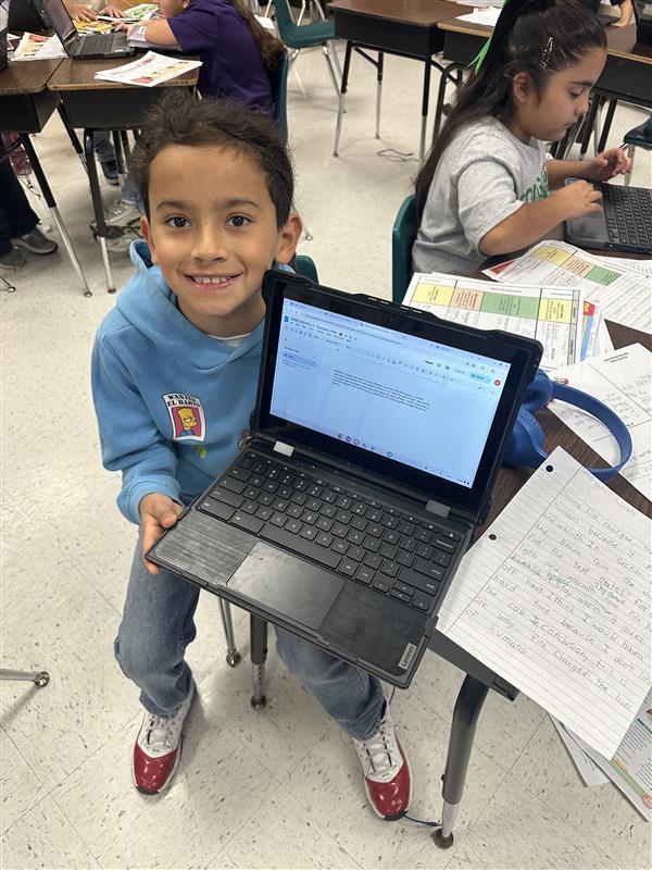 Kids posing while they work on their extended constructed response.