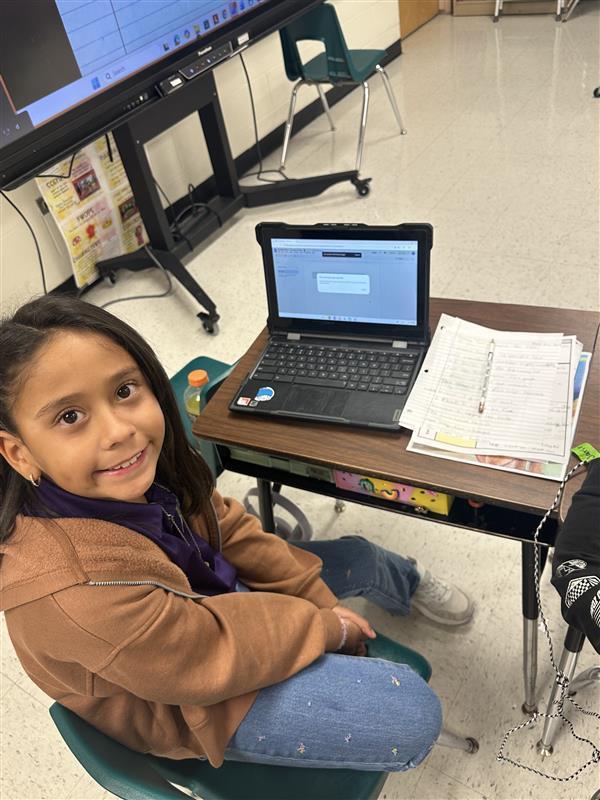 Kids posing while they work on their extended constructed response.