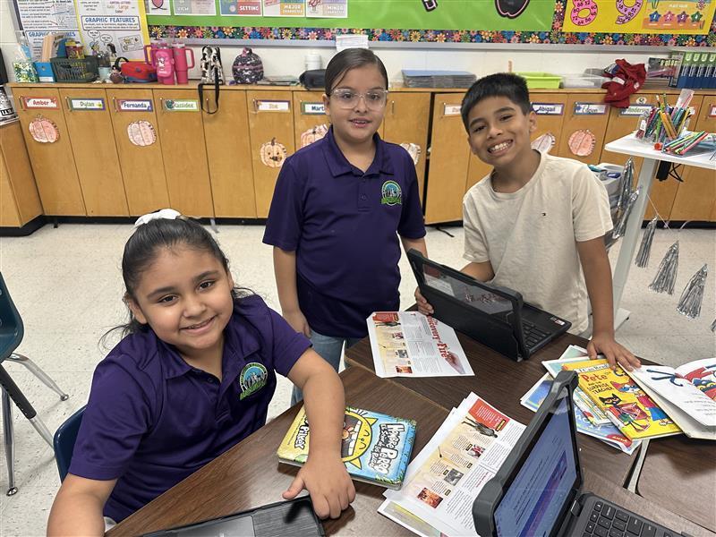 Kids posing while they work on their extended constructed response.