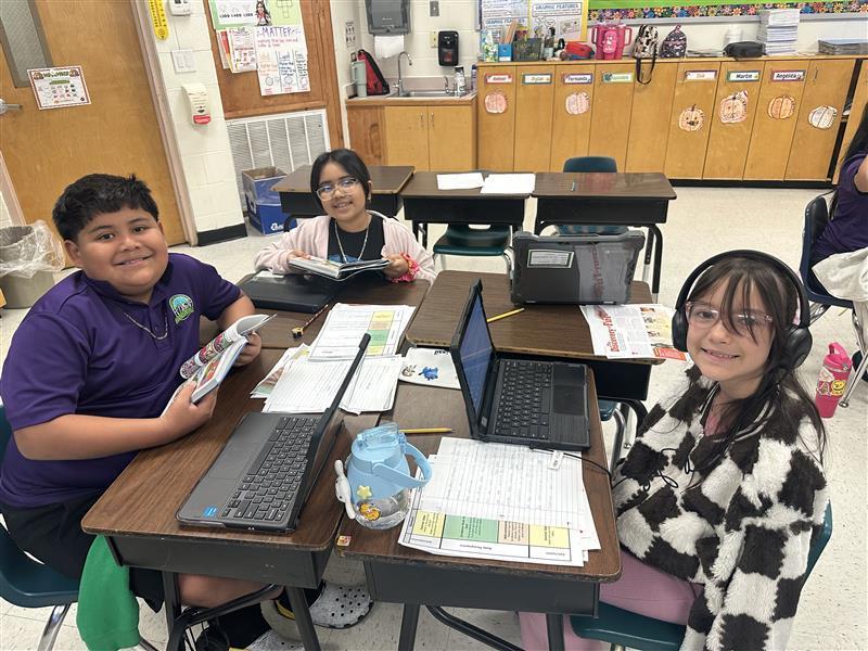 Kids posing while they work on their extended constructed response.