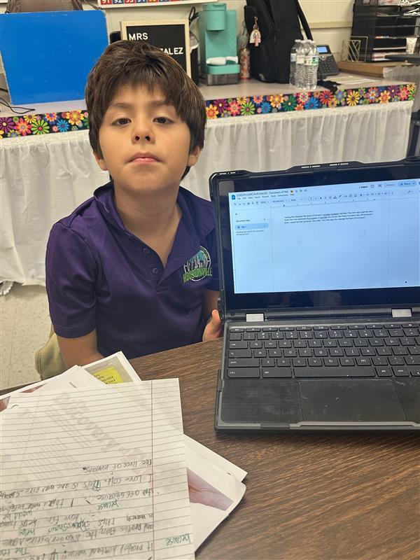 Kids posing while they work on their extended constructed response.