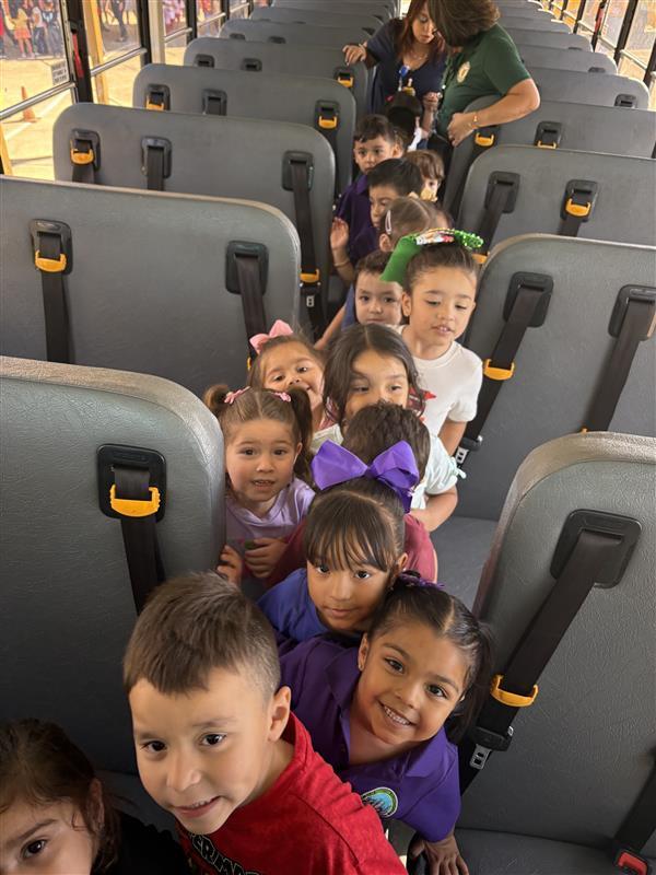 Kids posing during bus safety training.