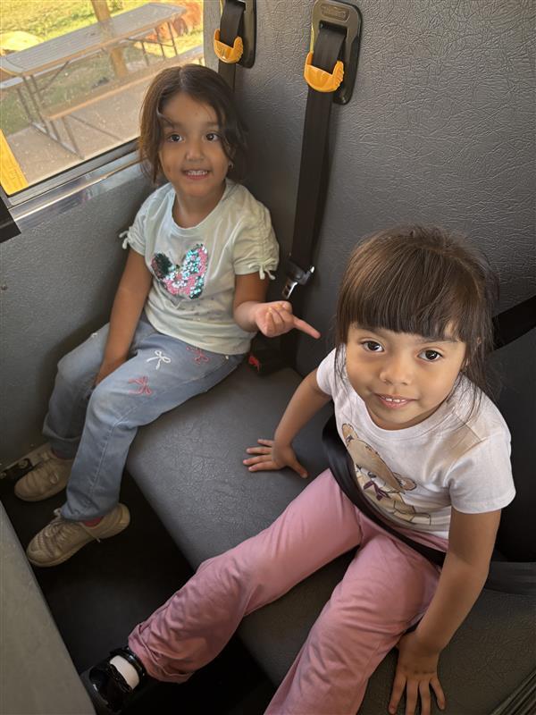 Kids posing during bus safety training.