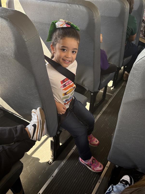 Kids posing during bus safety training.
