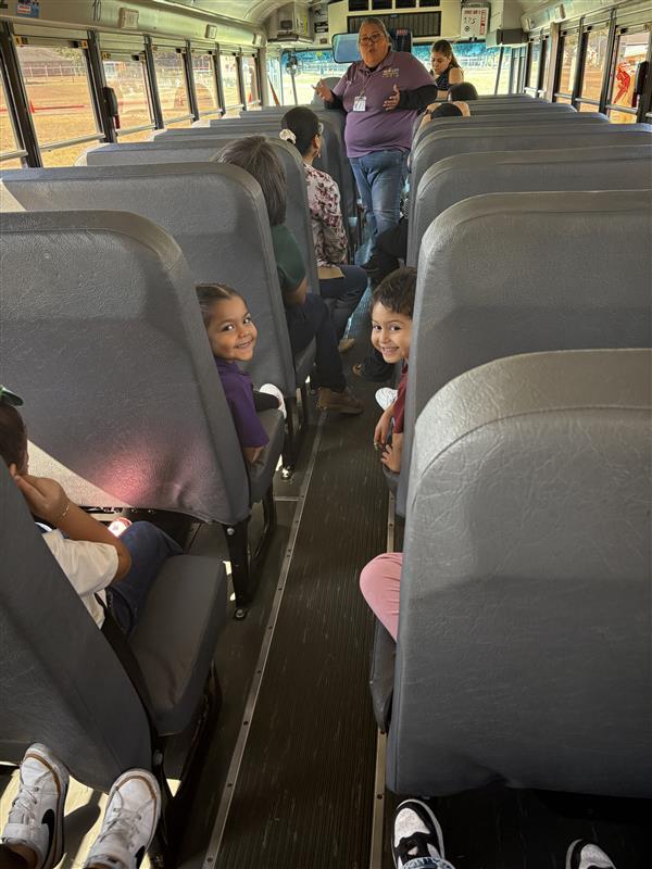 Kids posing during bus safety training.