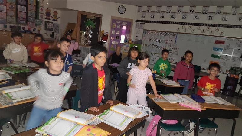 Kids posing with their glow in the dark bracelet.