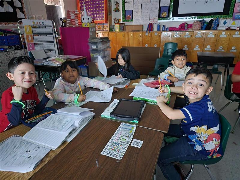 Kids posing with their glow in the dark bracelet.