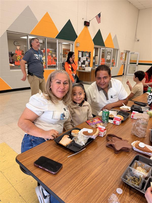 Family posing during Thanksgiving Family Lunch.