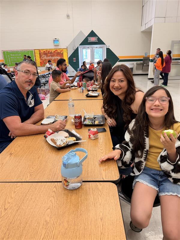 Family posing during Thanksgiving Family Lunch.