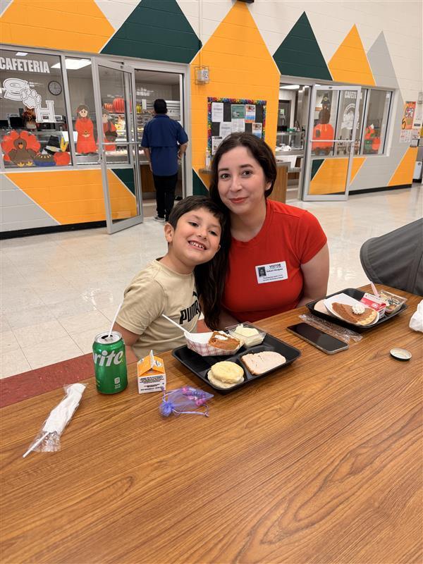 Family posing during Thanksgiving Family Lunch.