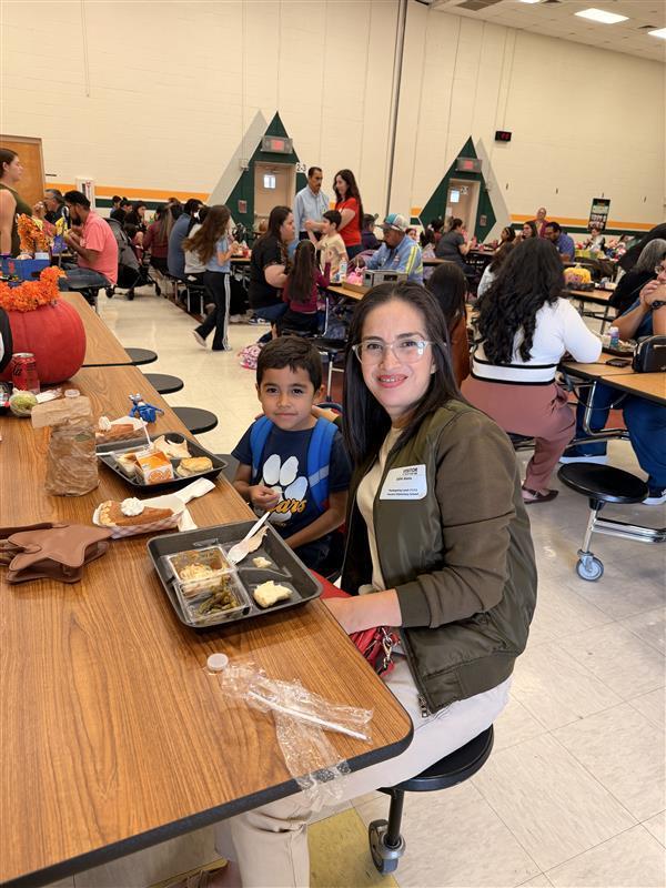 Family posing during Thanksgiving Family Lunch.