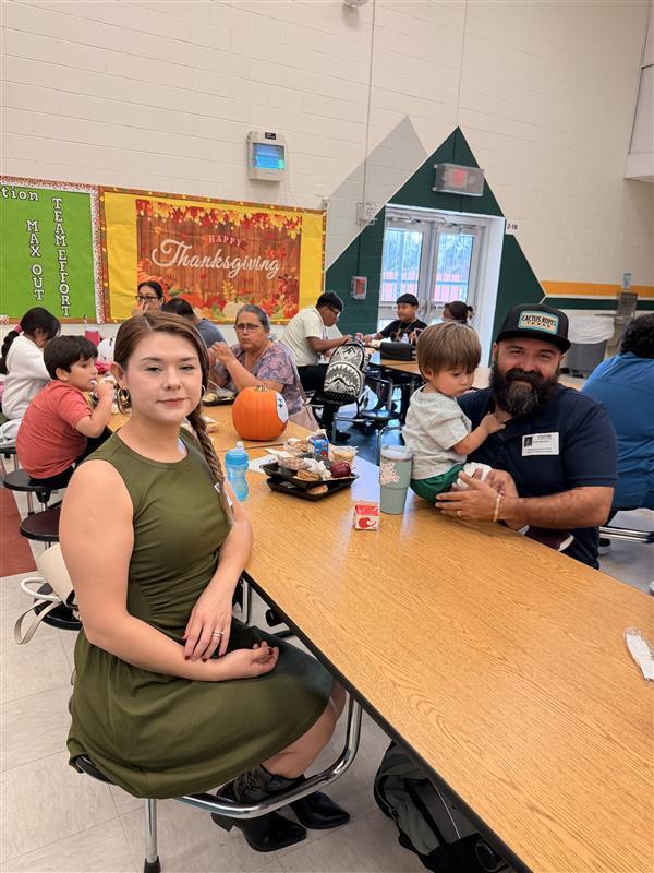 Family posing during Thanksgiving Family Lunch.