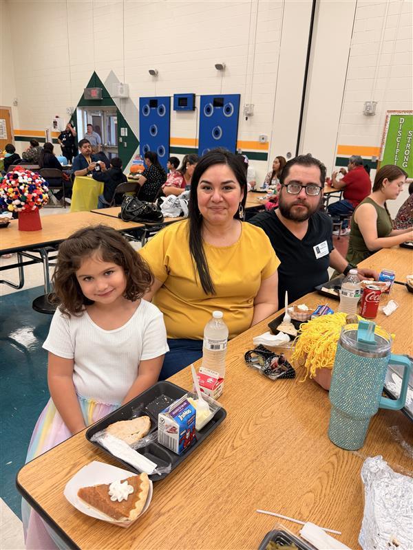 Family posing during Thanksgiving Family Lunch.