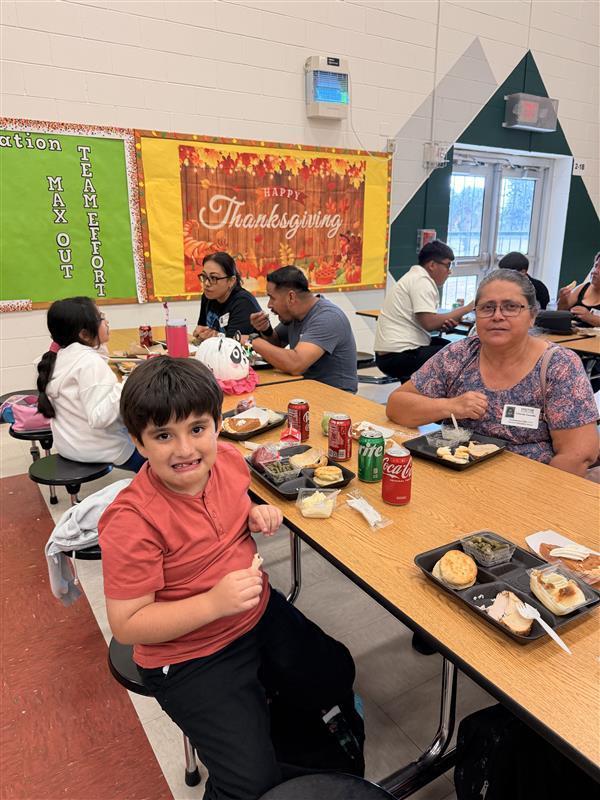 Family posing during Thanksgiving Family Lunch.