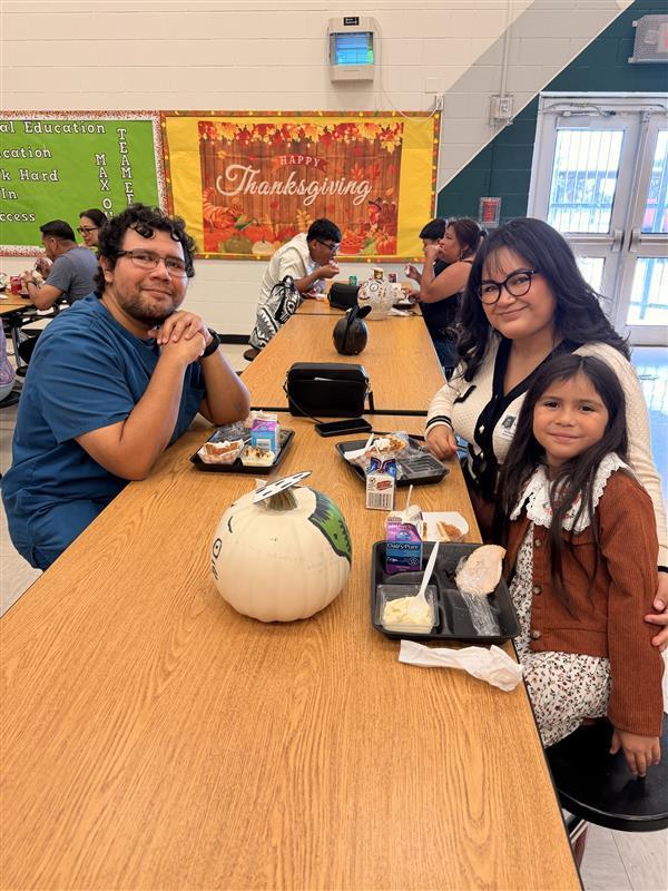 Family posing during Thanksgiving Family Lunch.