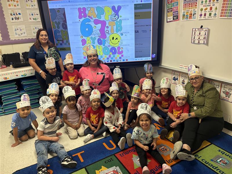 Ms. Esqueda's Pre-K class posing.