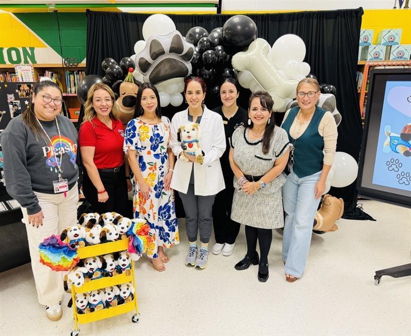 Adults posing for picture.