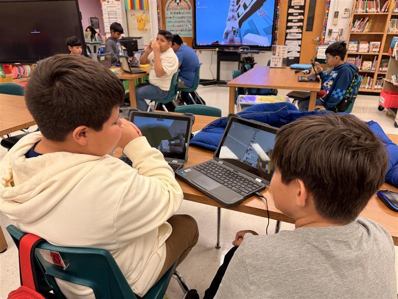 Kids working on Minecraft tasks for Esports.