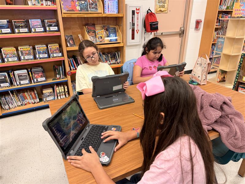 Kids working on Minecraft tasks for Esports.