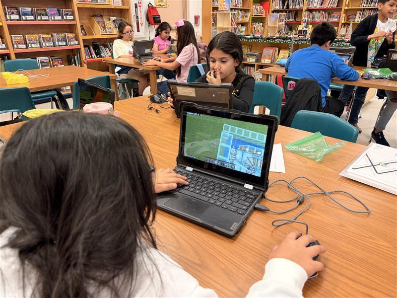 Kids working on Minecraft tasks for Esports.