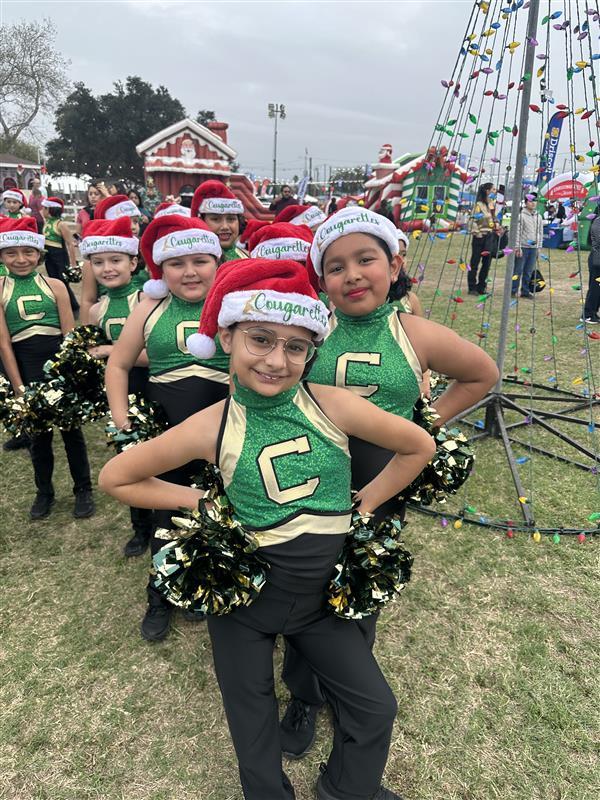 Cougarettes posing before dancing.