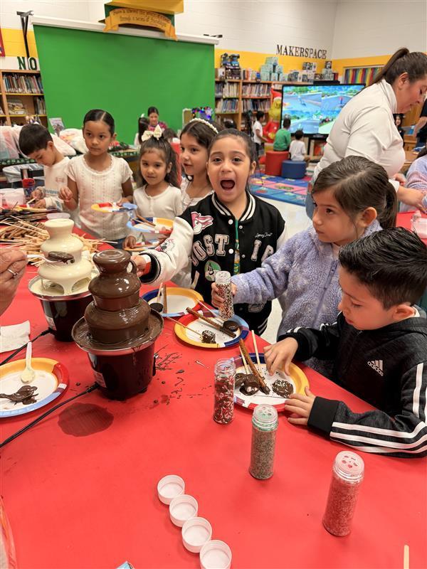 Kids getting treats at the library.