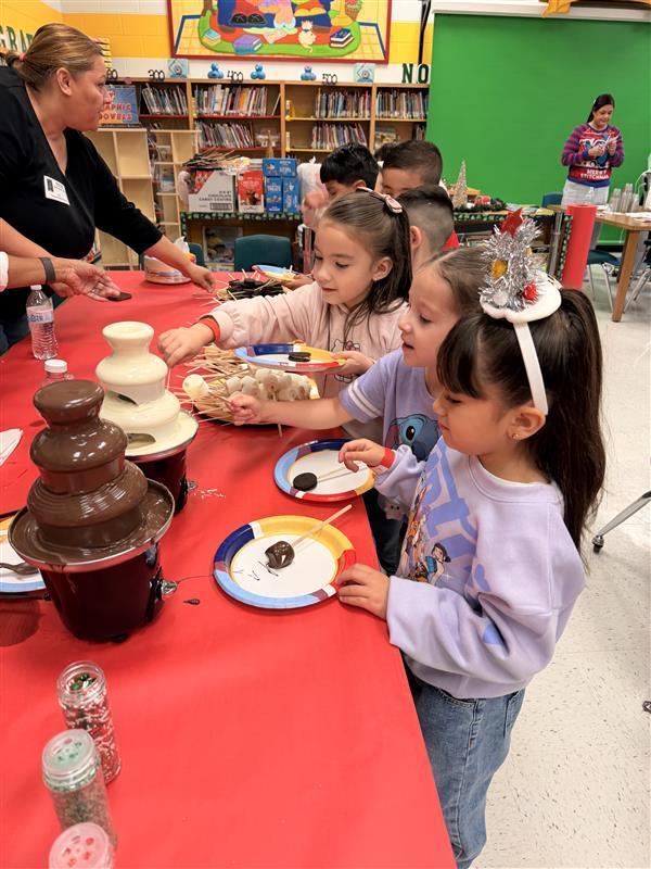 Kids getting treats at the library.