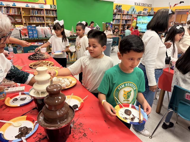 Kids getting treats at the library.