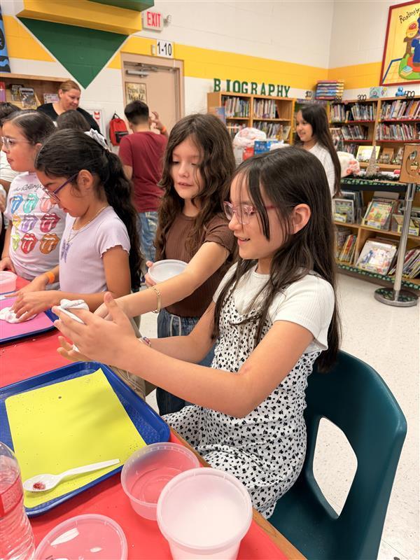 Kids working on activity at the library.