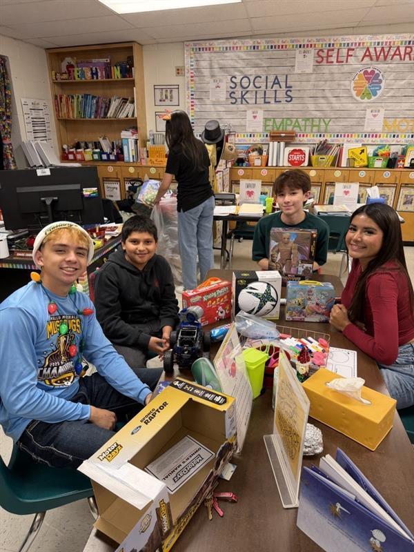 Students posing with gifts.