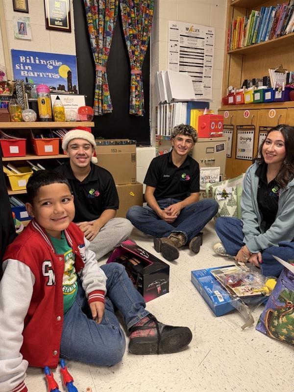 Students posing with gifts.