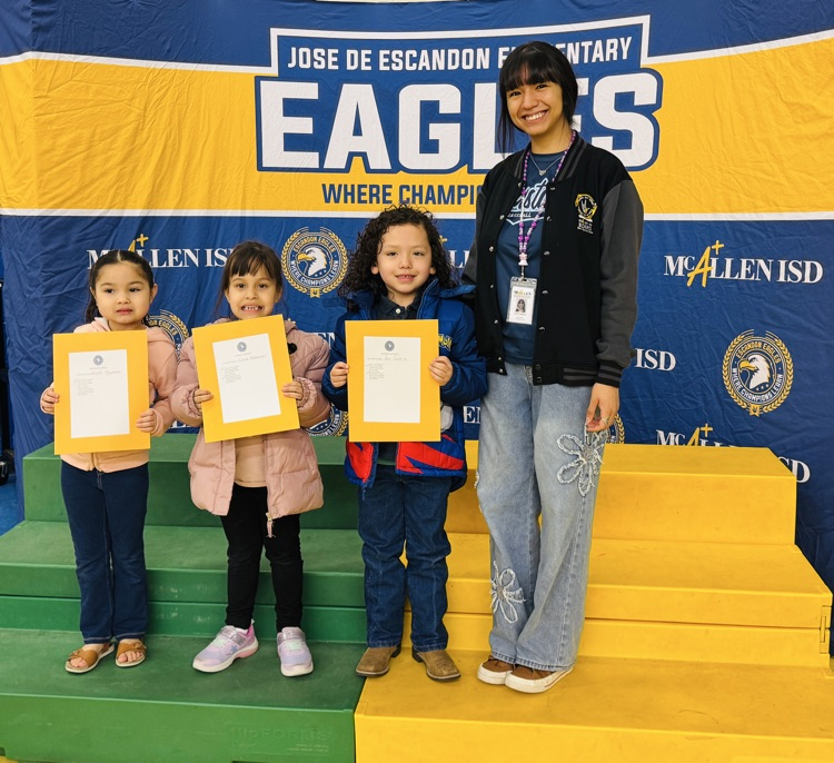 students that received awards pose for the camera
