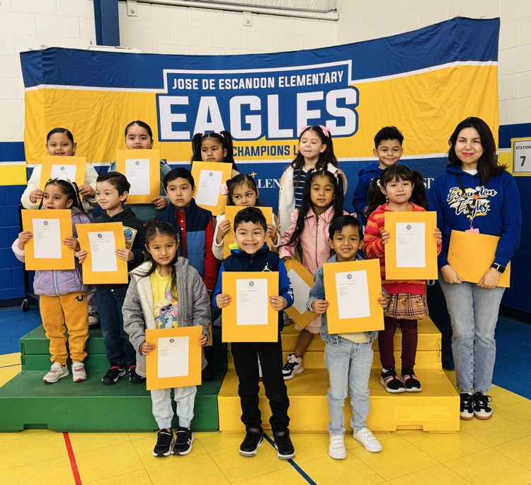 students that received awards pose for the camera