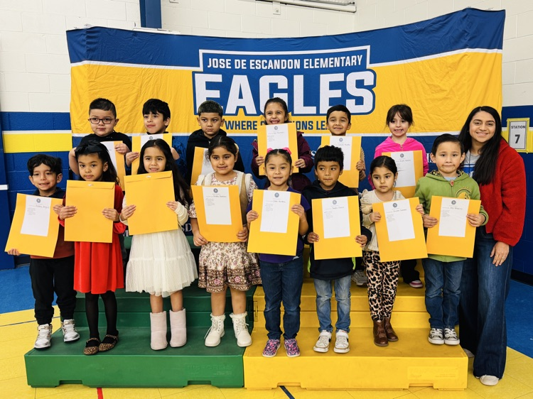 students that received awards pose for the camera