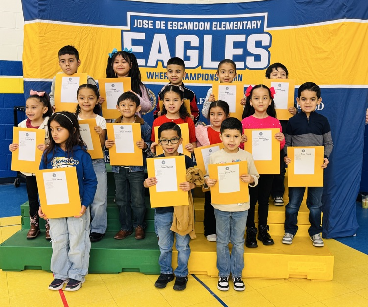 students that received awards pose for the camera