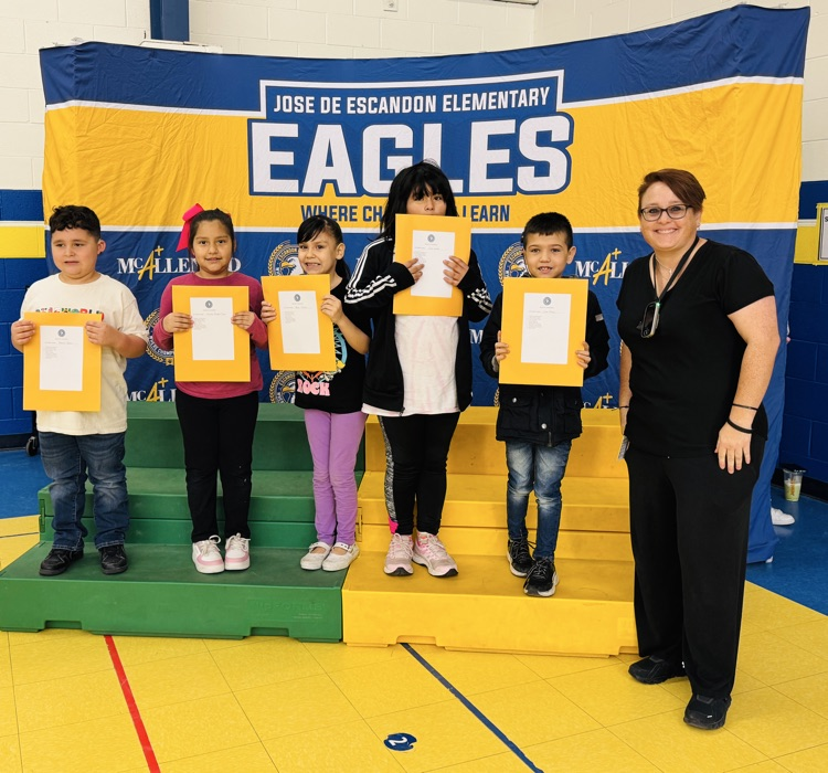 students that received awards pose for the camera