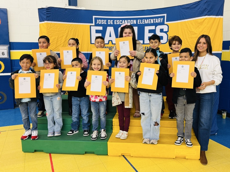 students that received awards pose for the camera