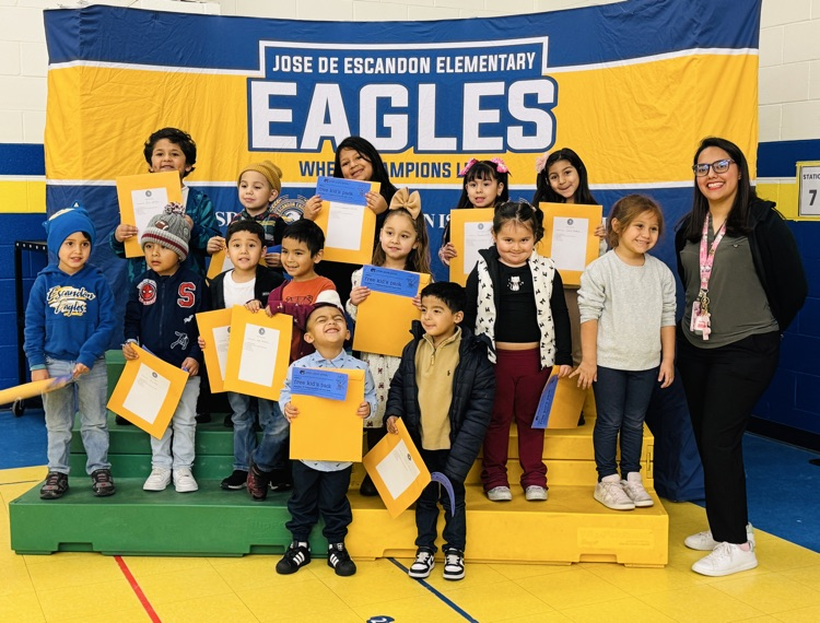students that received awards pose for the camera