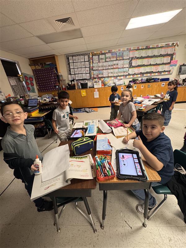 Kids posing as they work.