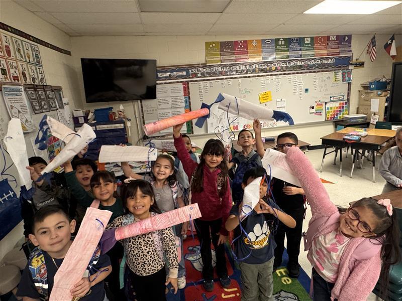 Kids posing with finished products.