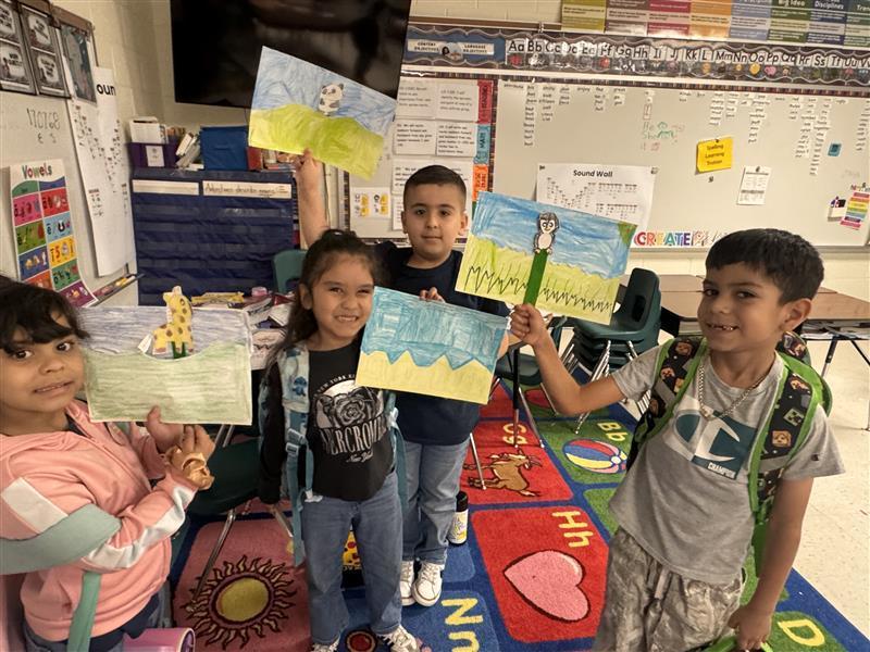 Kids posing with finished products.